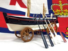 Wooden model of an early lifeboat by Nauticalia London. A wonderful decorative piece, approx 34cm in