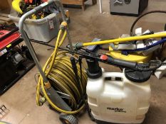 Hose reel and hose and a backpack sprayer