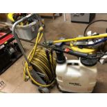 Hose reel and hose and a backpack sprayer