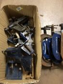 Collection of metal clamps and vices