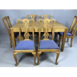 Modern oak dining table approx 150cm x 90cm, accompanied by eight dining chairs with padded seats