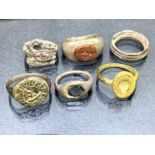 Collection of six rings of varying ages to include bronze signet ring, a marriage ring, a silver