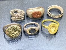 Collection of six rings of varying ages to include bronze signet ring, a marriage ring, a silver