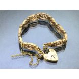 9ct Gold four bar bracelet with 9ct Gold heart shaped lock approx 16cm in length & 22g