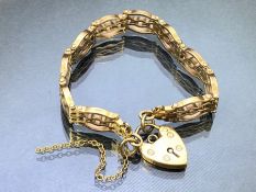 9ct Gold four bar bracelet with 9ct Gold heart shaped lock approx 16cm in length & 22g