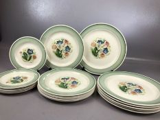 Collection of vintage Susie Cooper plates with hand painted floral sprays to the centre and green