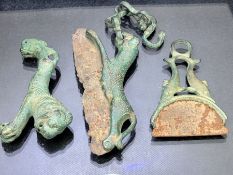 Collection of three razors, possibly Roman in origin, one in the form of a leopard or other wild cat