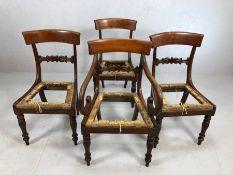 Set of four Victorian dining chairs with carved and shaped backs on turned front legs to include one