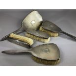 Five Piece hallmarked silver dressing table set comprising four brushes and a hand held mirror all
