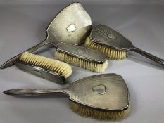 Five Piece hallmarked silver dressing table set comprising four brushes and a hand held mirror all