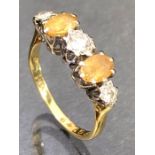 18ct Gold ring set with Oval faceted Citrines and a trio of platinum set Diamonds size 'N'