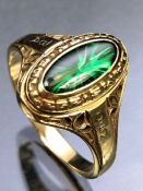 10ct Gold ring in the marquise style with interesting starburst effect green stone 9.6 x 4.3mm