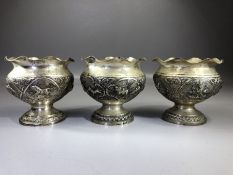 Three Indian silver bowls each marked V.75 and with Repousse decoration depicting Boars, Hunting