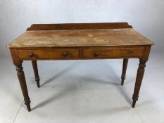 Two door desk on turned legs with upstand (A/F), approx 120cm x 50cm x 73cm tall