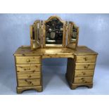 Pine dressing table with eight drawers approx 146cm x 44cm x 75cm tall, with triptych mirror above