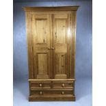 Pine two door wardrobe with hanging rail and three drawers to base, approx 104cm x 58c, x 192cm