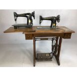 Original Singer sewing machine in wooden sewing cabinet with treadle, and one other