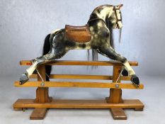 Vintage wooden hand-painted, English-made rocking horse with original leather saddle, with horse