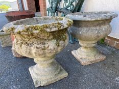 Pair of concrete garden planters, each approx 40cm in height (A/F)