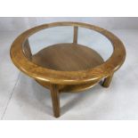 Mid Century style circular coffee table with single shelf beneath and glass top, approx 83cm in