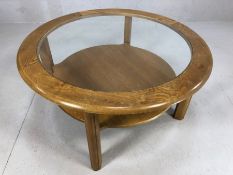 Mid Century style circular coffee table with single shelf beneath and glass top, approx 83cm in