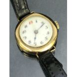 9ct Gold watch with circular dial, white face and leather strap