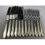 Set of six Silver handled fruit knives and forks hallmarked for Sheffield by Viner's Ltd (Emile