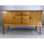 Mid Century walnut sideboard by GORDON RUSSELL of Broadway, with three drawers flanked by cupboards,