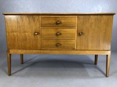Mid Century walnut sideboard by GORDON RUSSELL of Broadway, with three drawers flanked by cupboards,