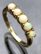 14ct Gold ring set with five circular Opals size 'K'