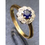 18ct Gold Diamond and Platinum set Sapphire ring with central Blue Sapphire surrounded by ten