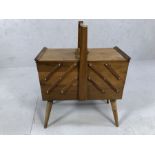 Vintage teak cantilever sewing box with extensive contents