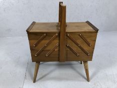 Vintage teak cantilever sewing box with extensive contents