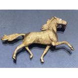 14ct Gold Brooch of a Horse with a diamond eye approx 45mm in length & 7.3g