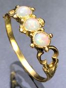 Delicate and ornate three stone Opal ring approx size 'M'