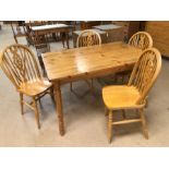 Pine kitchen table with four wheelback chairs, table approx. 120cm x 80cm