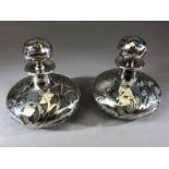 Pair of Art Nouveau Silver metal and glass scent bottles with stoppers approx 11cm tall and 10cm