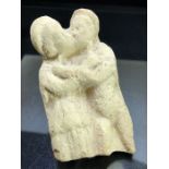 Fragmentary stone carving depicting lovers, possibly Greek, approx 11cm in height