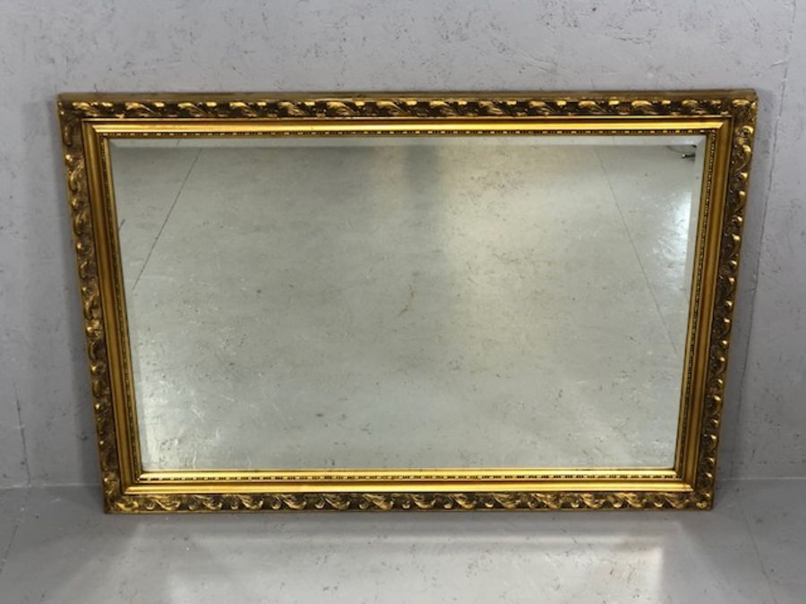 Modern gilt framed, bevel edged mirror, approx 73cm x 104cm