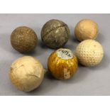 Sporting: Collection of six vintage Golf balls to include a hand stitched leather example