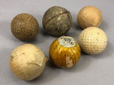 Sporting: Collection of six vintage Golf balls to include a hand stitched leather example