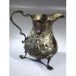 Hallmarked Georgian silver milk jug on three feet 10cm tall London possibly 1790 and approx 115g