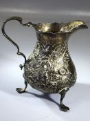 Hallmarked Georgian silver milk jug on three feet 10cm tall London possibly 1790 and approx 115g