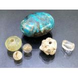 Collection of beads of varying ages to include a folded mosaic glass bead, a rock crystal bead and