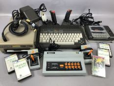 Vintage games consoles: Commodore plus/4 computer keyboard, 1541 disk drive, Datassette, joysticks