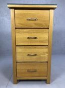 Modern oak chest of four drawers with glass top, approx 55cm x 43cm x 100cm tall