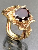 9ct Gold fully hallmarked ring in the style of a tree or vine and set with a large faceted Garnet