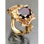 9ct Gold fully hallmarked ring in the style of a tree or vine and set with a large faceted Garnet