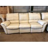 Modern cream leather three seater sofa, approx 210cm in length, with reclining seats
