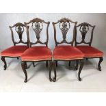 Set of four ornate velvet seated chairs, two small with castors to front feet